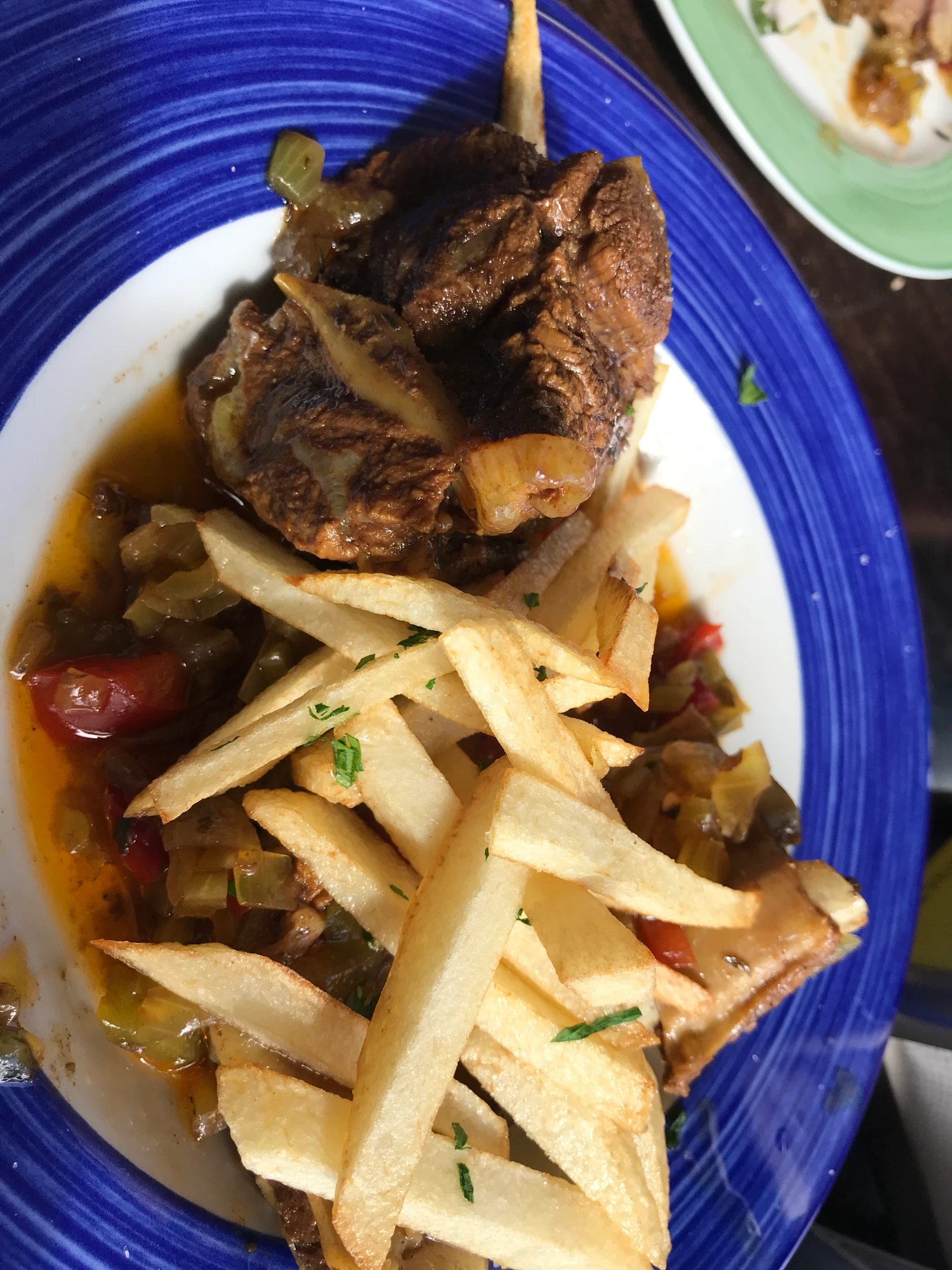 Slow-cooked island meat stew with fries